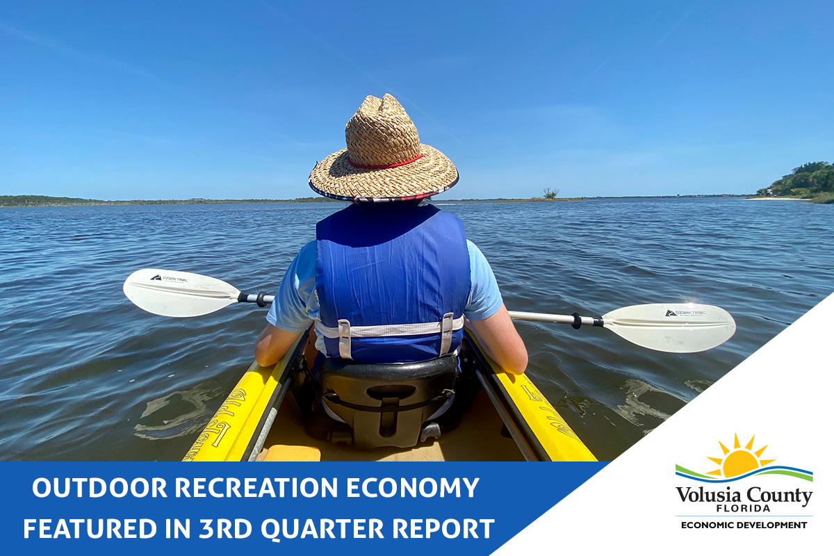A person kayaking on the Intracoastal Waterway. Text reads Outdoor Recreation Economy featured in 3rd quarter report from Volusia County Economic Development